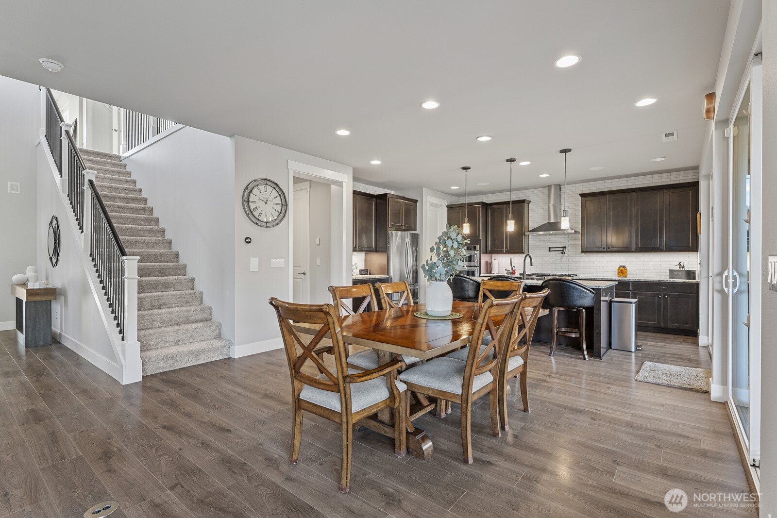 22752 Southeast 265th Place Maple Valley, WA 98038 - Photo 5 of 39 a view of a dining room with furniture and wooden floor