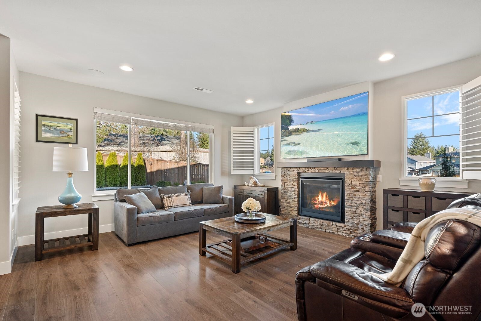 22752 Southeast 265th Place Maple Valley, WA 98038 - Photo 10 of 39 a living room with furniture and a fireplace