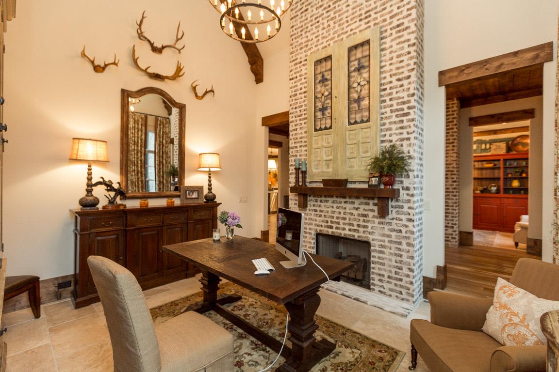 222 Poydras Street Franklin, TN 37069 - Photo 11 of 30 a living room with furniture a fireplace and a table