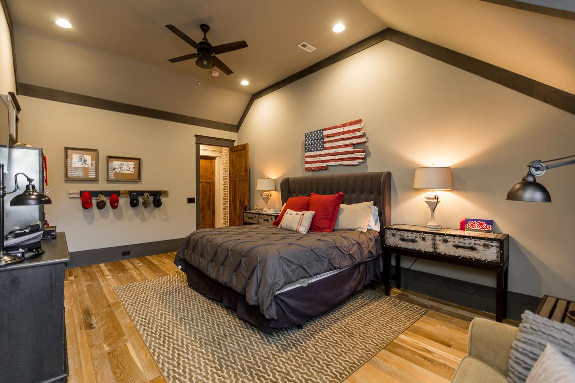 222 Poydras Street Franklin, TN 37069 - Photo 22 of 30 a bedroom with a bed and a chandelier