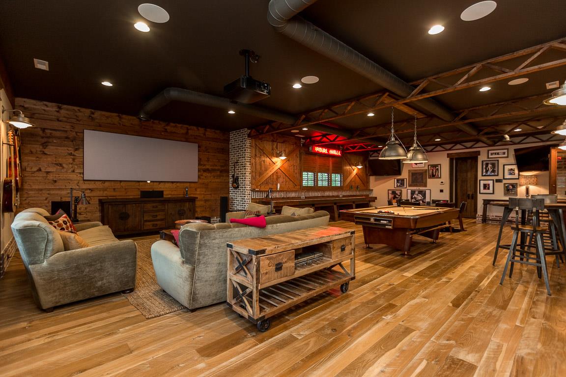 222 Poydras Street Franklin, TN 37069 - Photo 25 of 30 a living room with furniture a flat screen tv and a fireplace