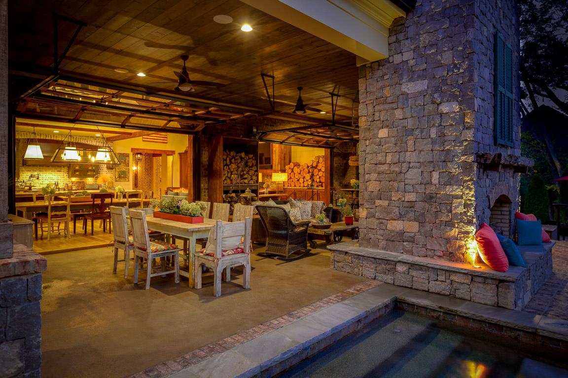 222 Poydras Street Franklin, TN 37069 - Photo 27 of 30 a view of a patio with dining table and chairs with a barbeque grill and couches