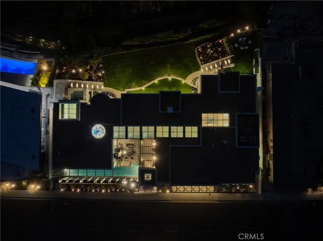 a kitchen with stainless steel appliances kitchen island granite countertop a table chairs in it and wooden floors