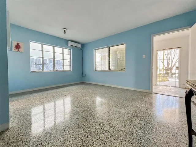 a view of an empty room with a window