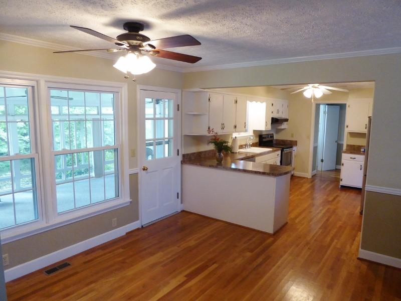 2115 Coles Knob Road Northeast Check, VA 24072 - Photo 8 of 36 a kitchen with stainless steel appliances granite countertop a stove cabinets and wooden floor