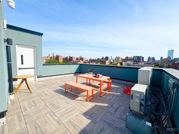 a view of a terrace with sitting area