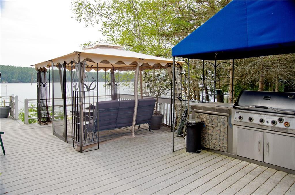78 Pine Point Road Oxford, ME 04270 - Photo 33 of 35 Large deck and cook area / deck...