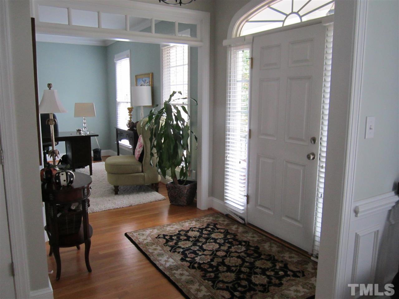 3209 Tall Tree Place Raleigh, NC 27607 - Photo 3 of 22 a living room with furniture and a potted plant