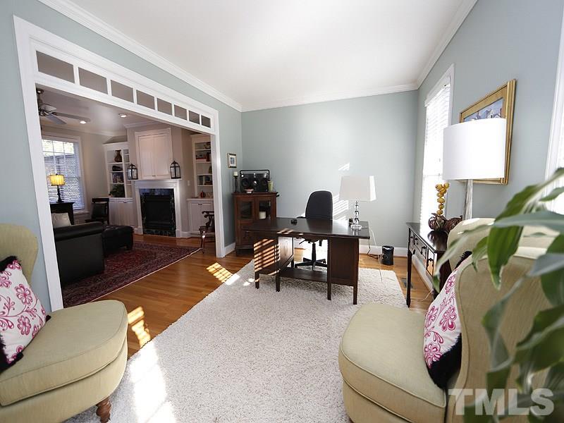 3209 Tall Tree Place Raleigh, NC 27607 - Photo 5 of 22 a living room with furniture rug and window