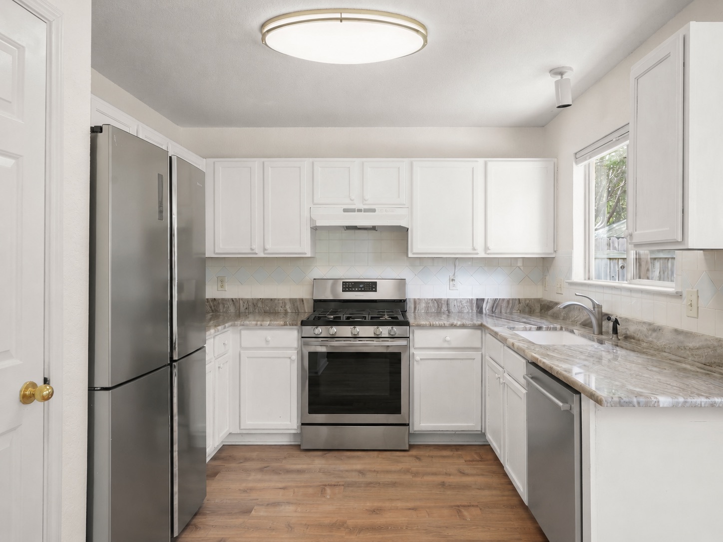 438 Katy Crossing Georgetown, TX 78626 - Photo 7 of 24 Culinary delights await in this bright kitchen with ample counter space and modern appliances.
