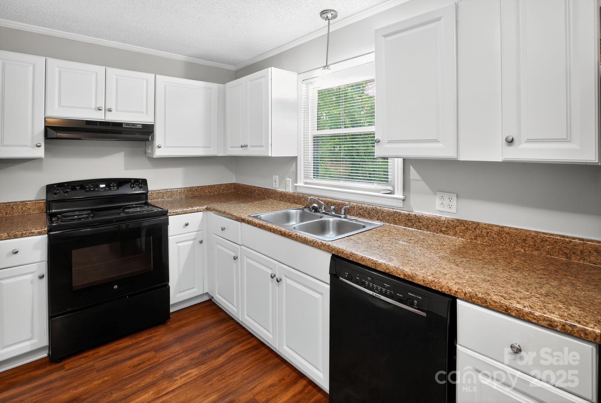 3725 Harrogate Road Columbia, SC 29210 - Photo 16 of 31 a kitchen with granite countertop white cabinets and a stove