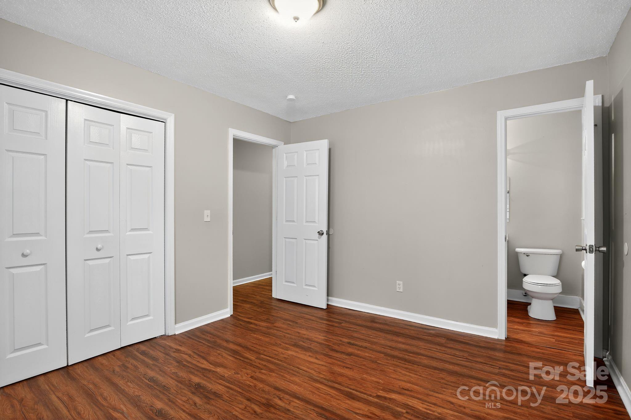3725 Harrogate Road Columbia, SC 29210 - Photo 22 of 31 a view of room with wooden floor and bathroom view