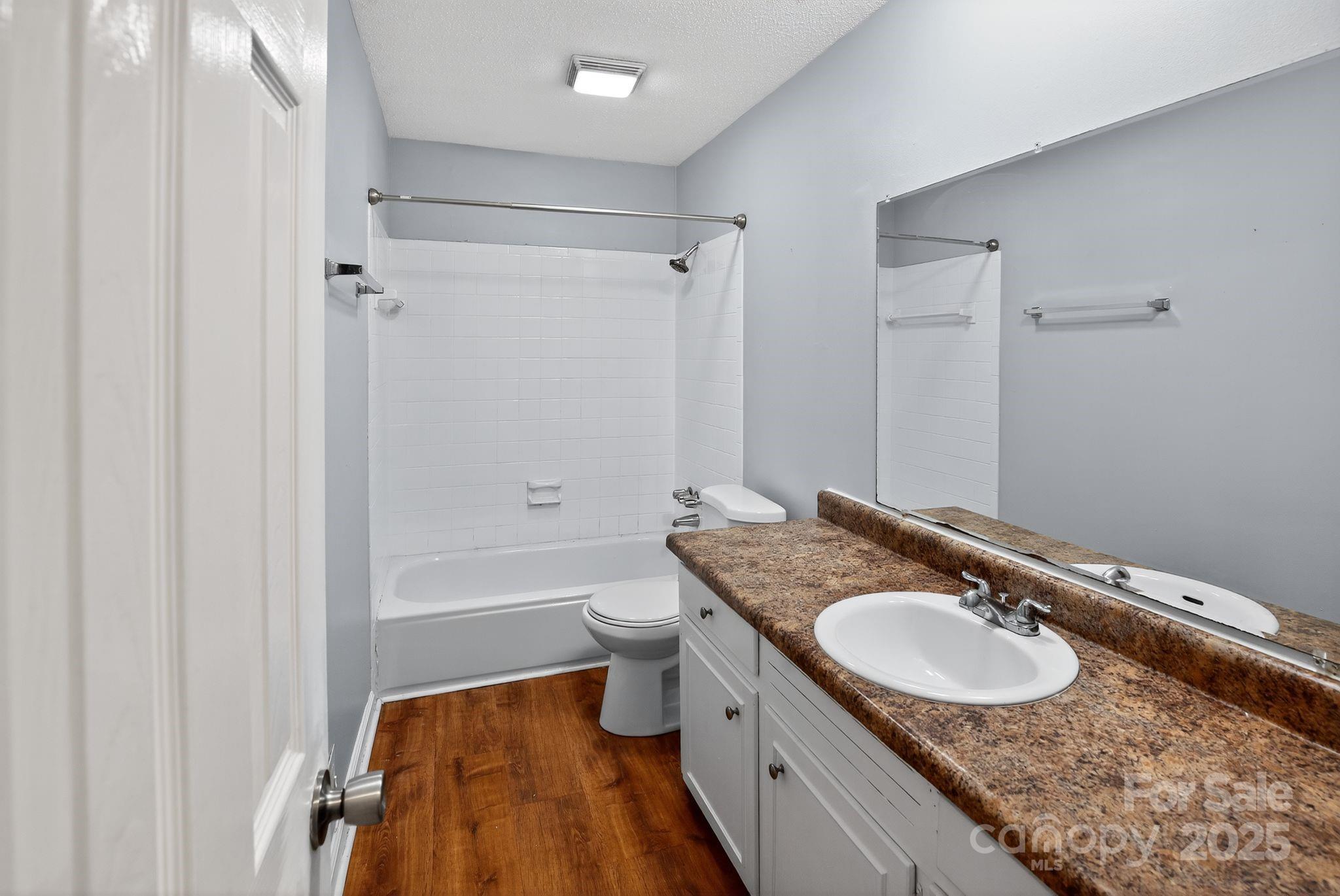 3725 Harrogate Road Columbia, SC 29210 - Photo 24 of 31 a bathroom with a granite countertop sink a mirror a bathtub and shower