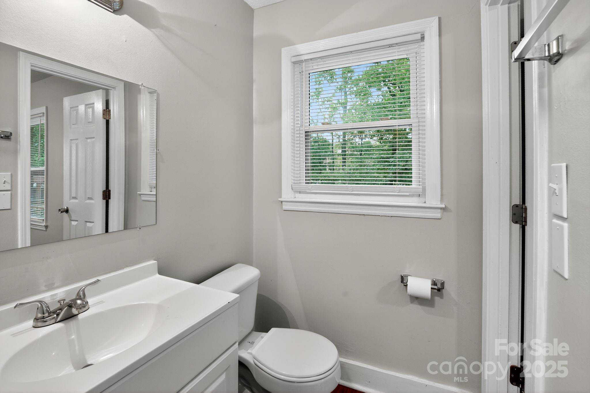 3725 Harrogate Road Columbia, SC 29210 - Photo 27 of 31 a bathroom with a sink a toilet and a window