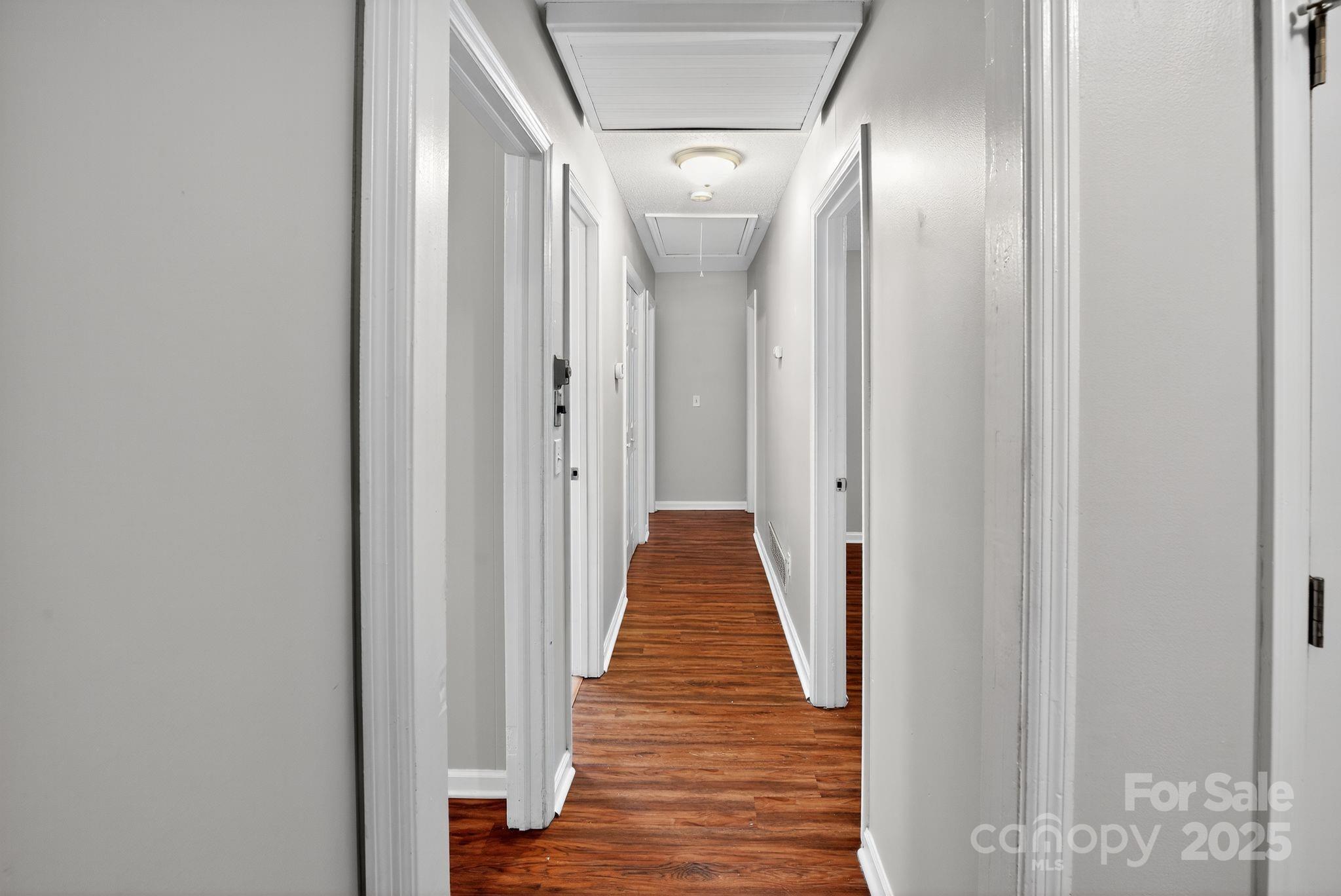 3725 Harrogate Road Columbia, SC 29210 - Photo 29 of 31 a view of a hallway with wooden floor and stairs