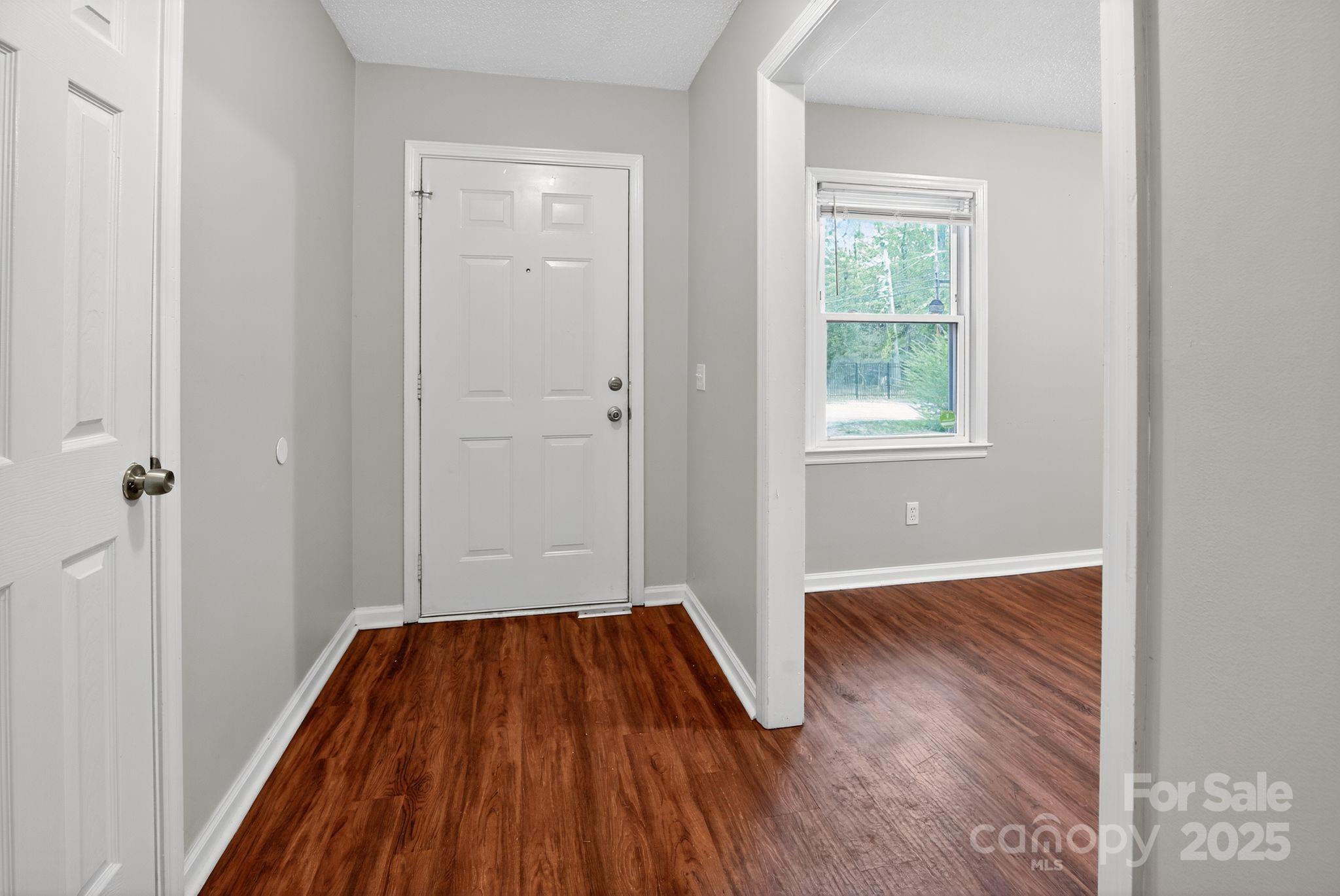 3725 Harrogate Road Columbia, SC 29210 - Photo 7 of 31 an empty room with wooden floor and a window