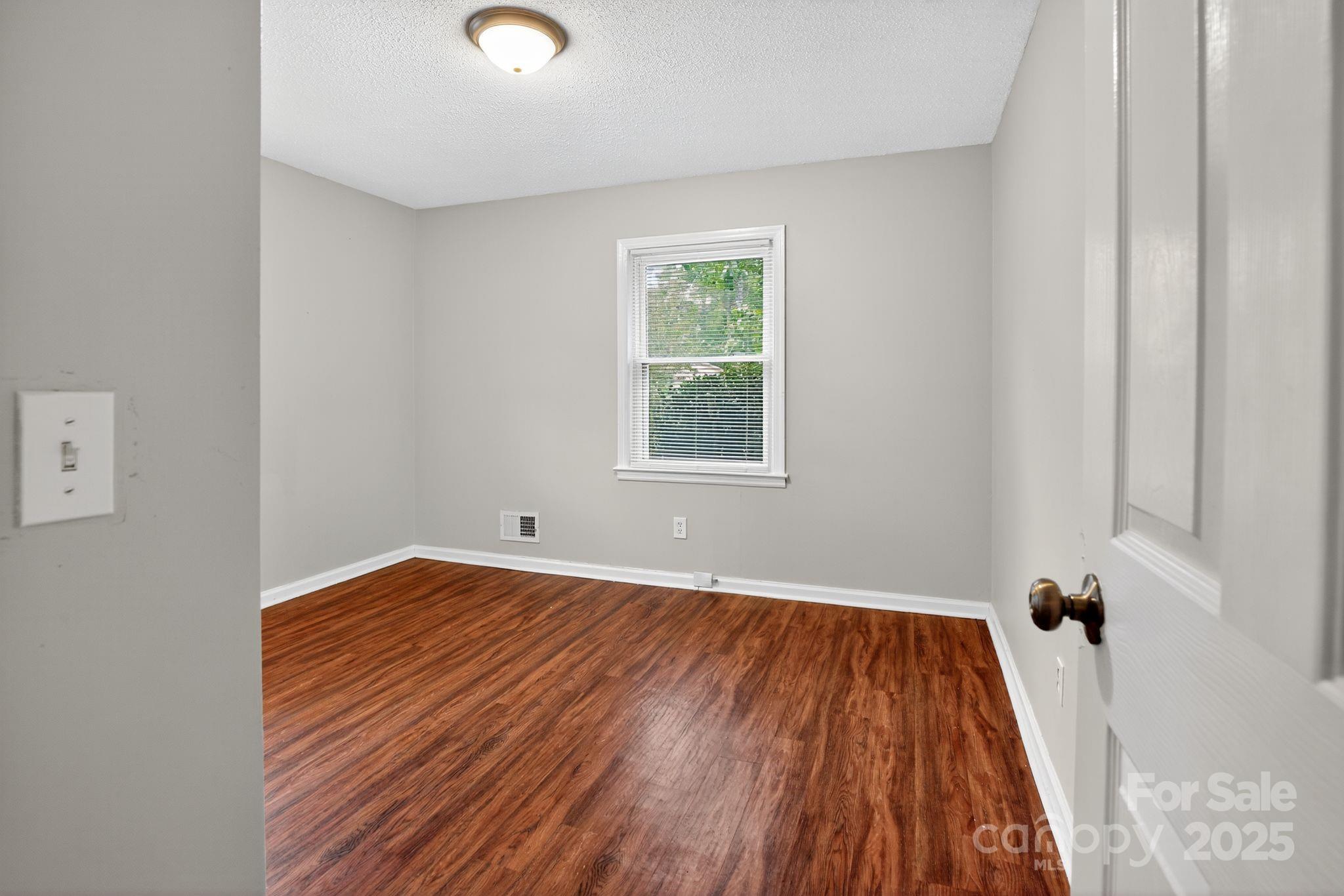 3725 Harrogate Road Columbia, SC 29210 - Photo 8 of 31 an empty room with windows