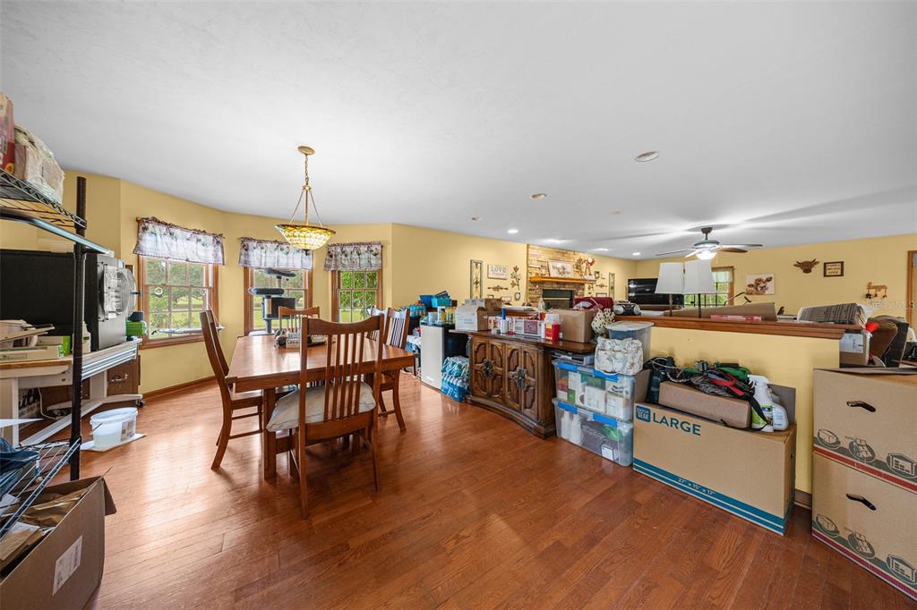 732 Carl Wilson Road Fort White, FL 32038 - Photo 17 of 80 a view of a dining room with furniture window and wooden floor