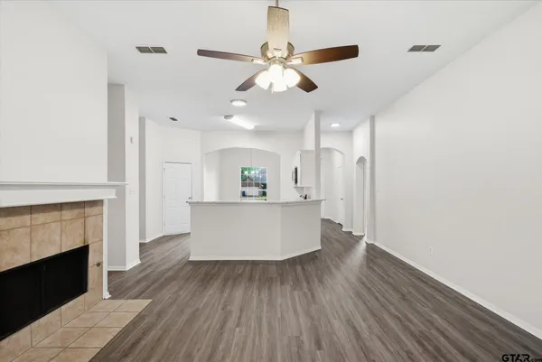 a view of kitchen with cabinets and wooden floor