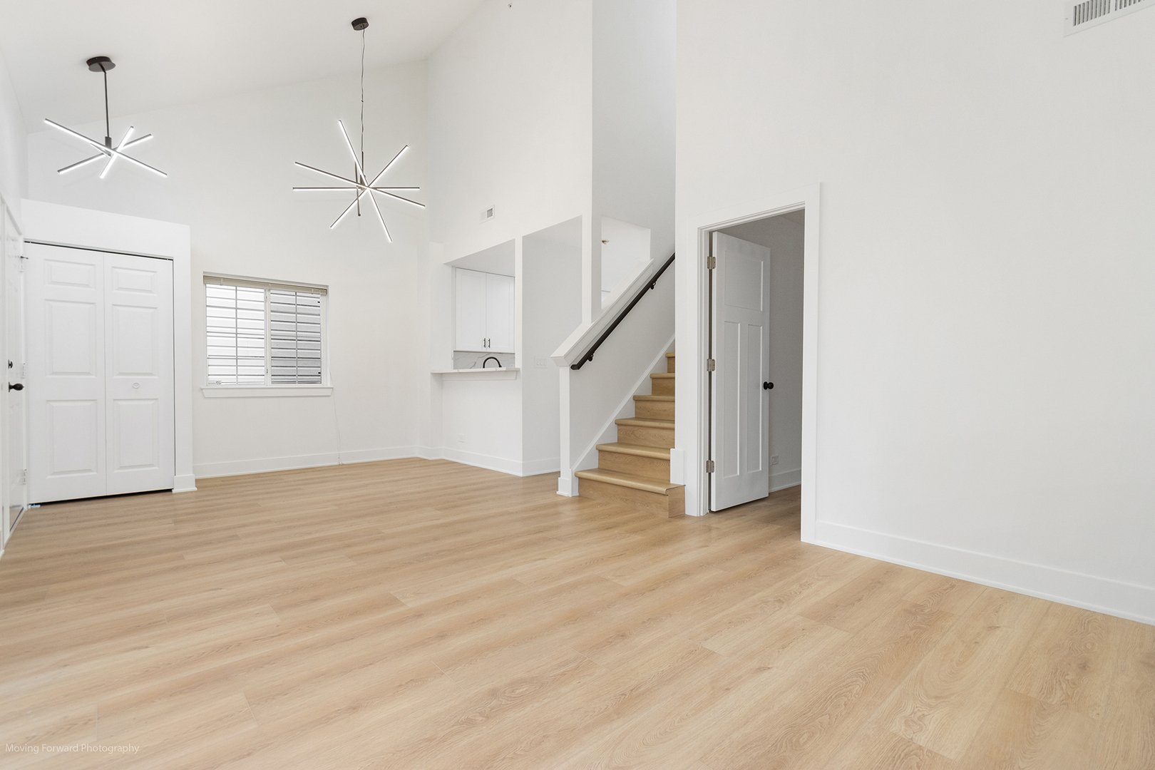 372 Windsong Court Bolingbrook, IL 60440 - Photo 11 of 29 a view of an empty room with wooden floor and stairs