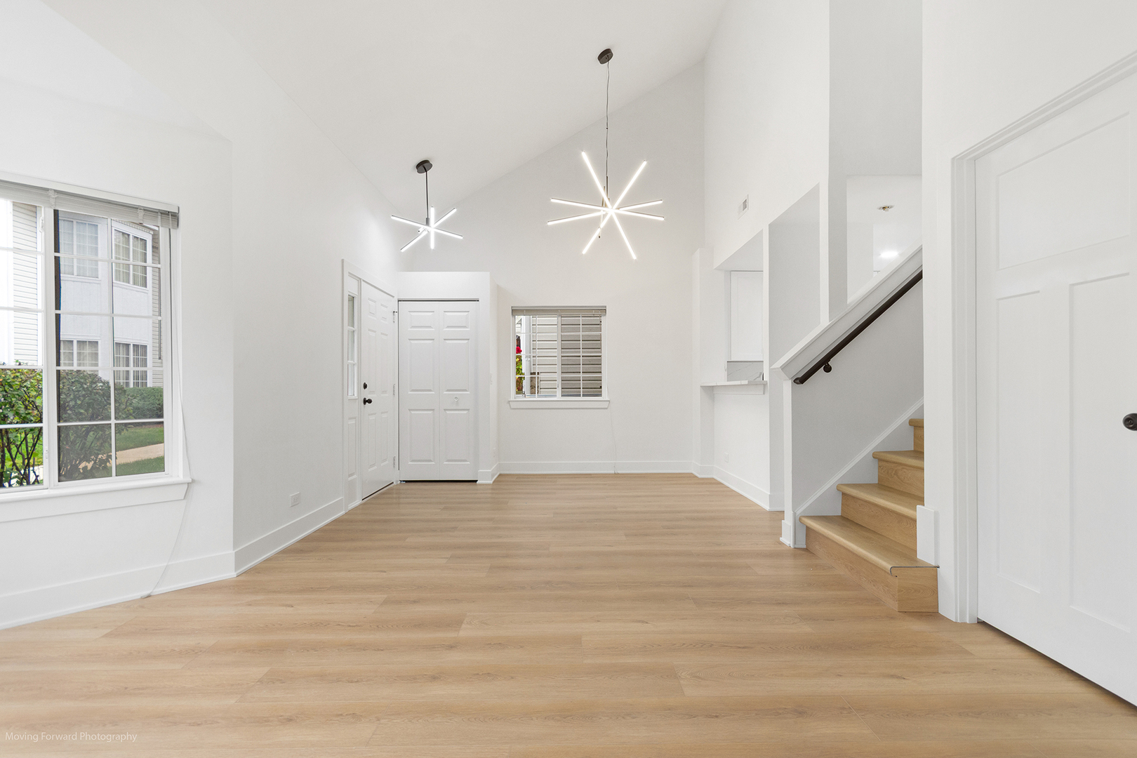 372 Windsong Court Bolingbrook, IL 60440 - Photo 13 of 29 a view of an empty room with wooden floor and a ceiling fan