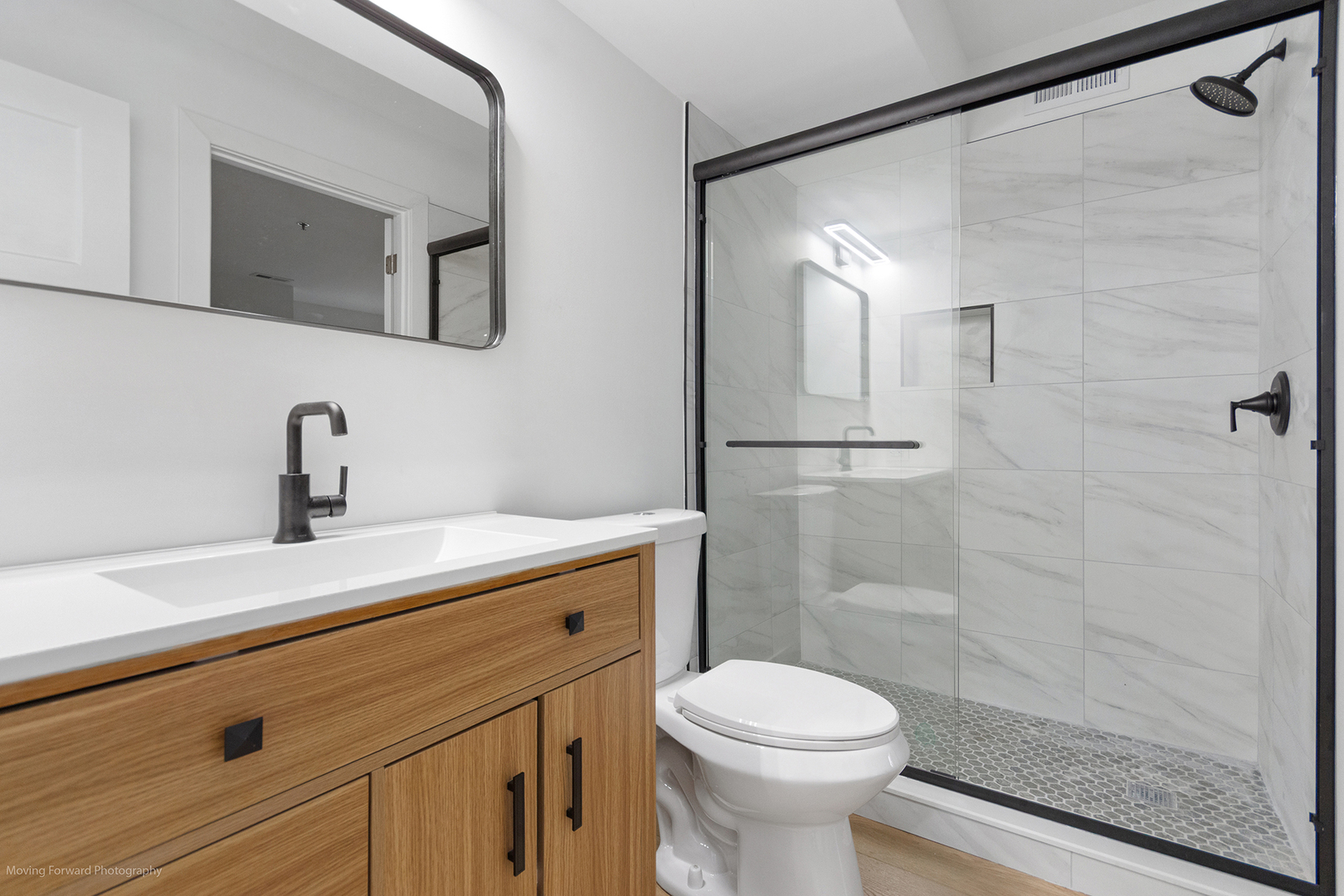 372 Windsong Court Bolingbrook, IL 60440 - Photo 22 of 29 a bathroom with a sink a toilet and shower