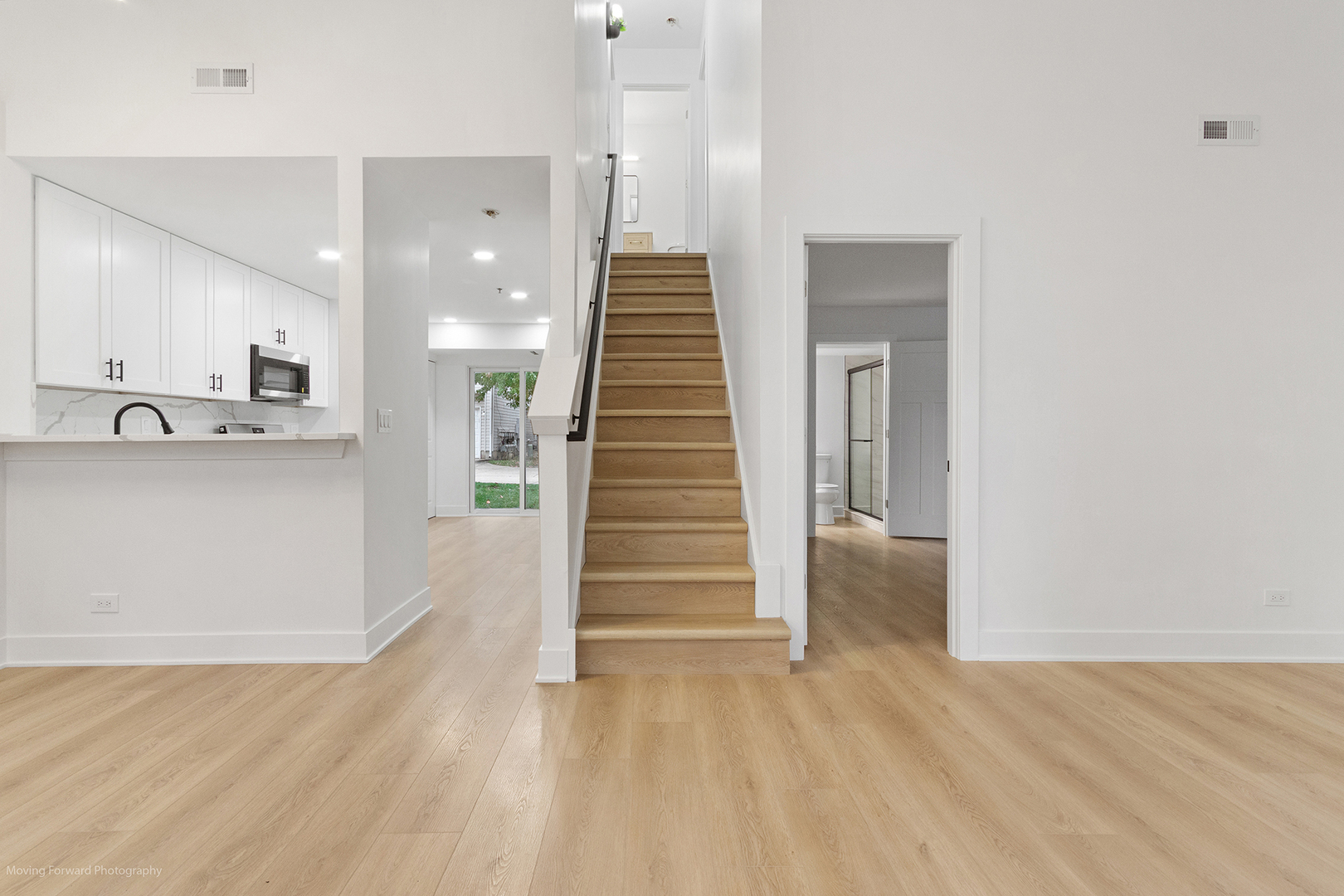 372 Windsong Court Bolingbrook, IL 60440 - Photo 8 of 29 a view of a hallway with stairs and ventilation