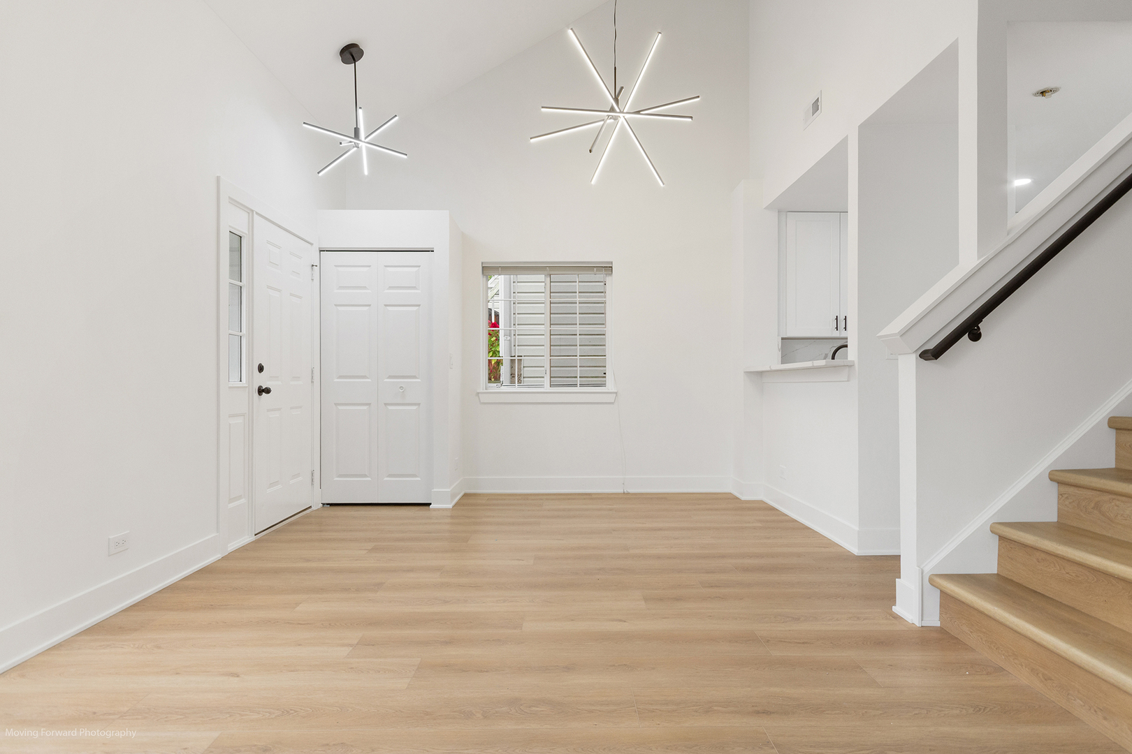 372 Windsong Court Bolingbrook, IL 60440 - Photo 9 of 29 a view of an empty room with wooden floor and a ceiling fan