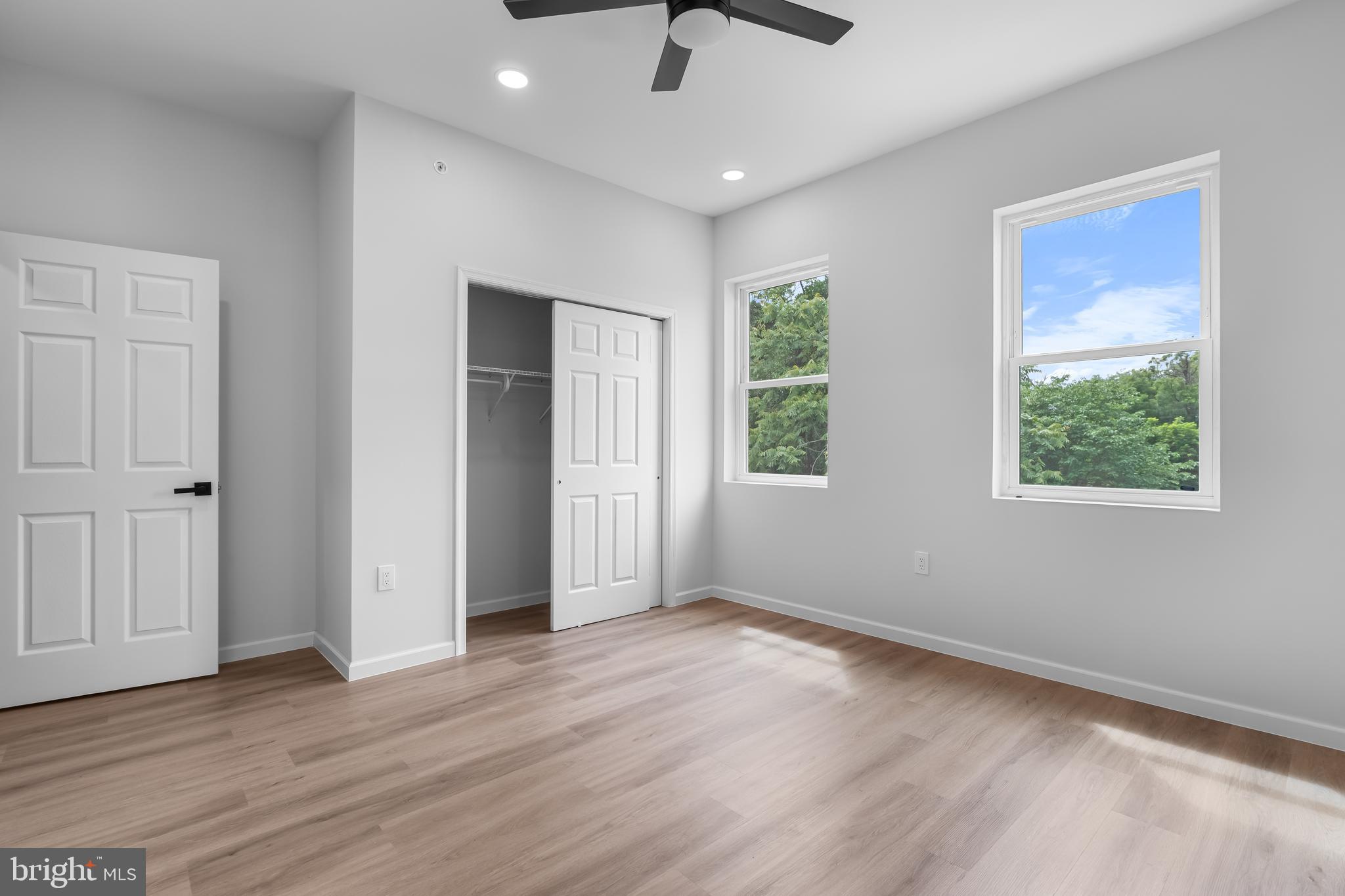 1242 North 15th Street, Unit 2 Philadelphia, PA 19121 - Photo 11 of 19 a view of an empty room with wooden floor and a window
