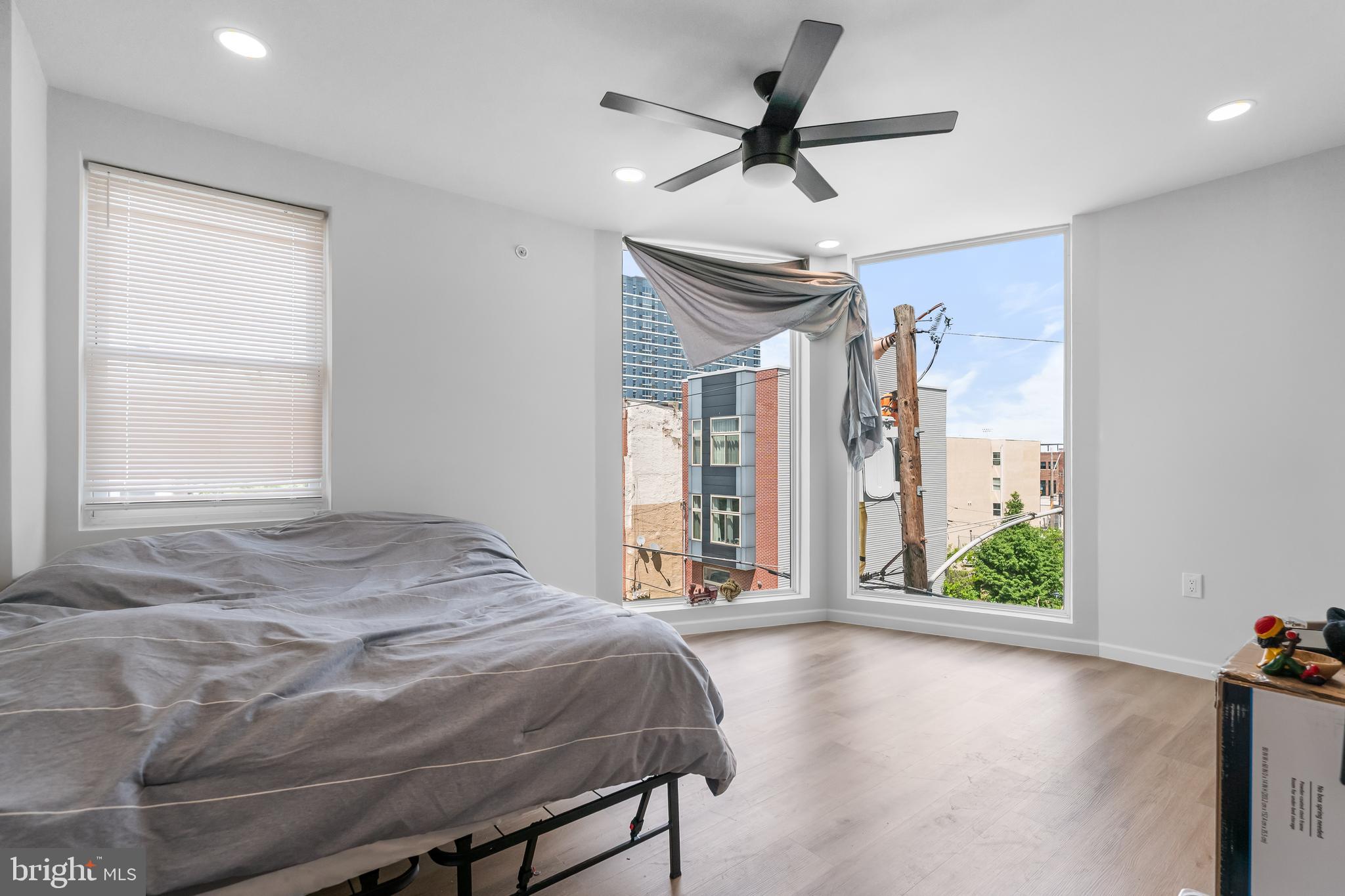 1242 North 15th Street, Unit 2 Philadelphia, PA 19121 - Photo 15 of 19 a bedroom with a bed and a large window