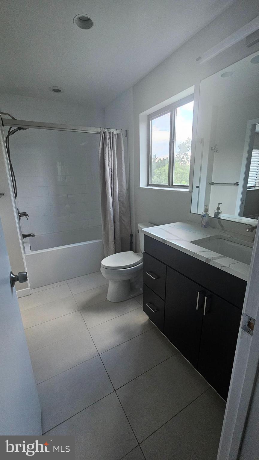 14002 Korba Place, Unit 4F Laurel, MD 20707 - Photo 5 of 9 a bathroom with a sink and a mirror