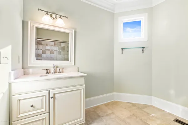 a living room with furniture a fireplace and a chandelier