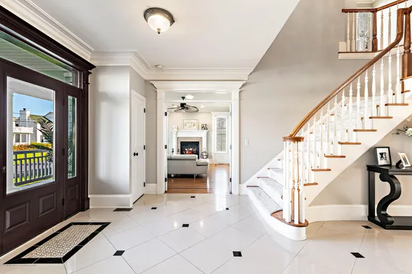 a living room with fireplace furniture and a wooden floor