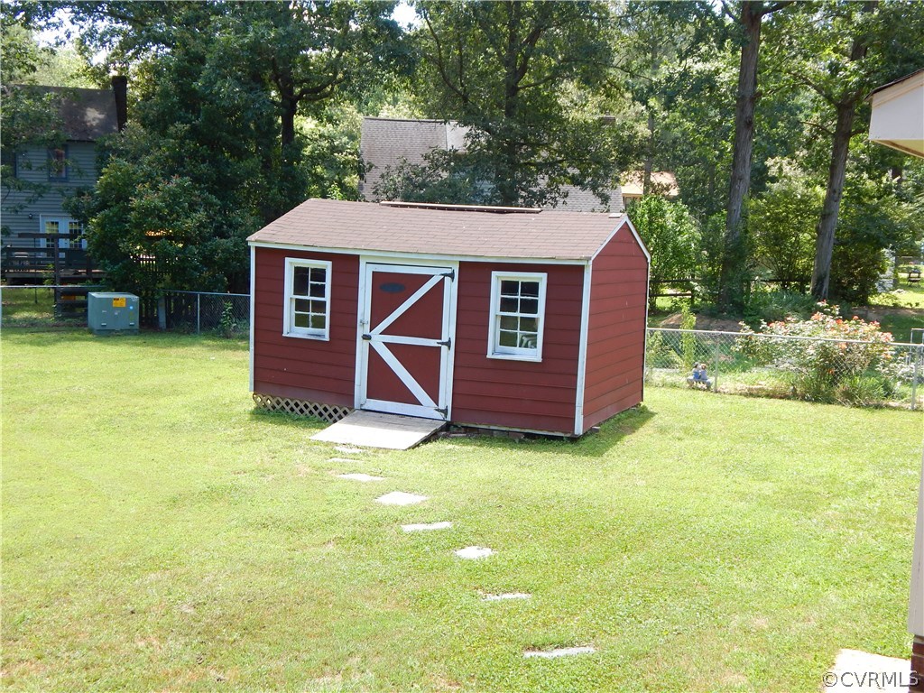 4813 Rollingway Road Chesterfield, VA 23832 - Photo 11 of 13 a backyard of a house with seating space
