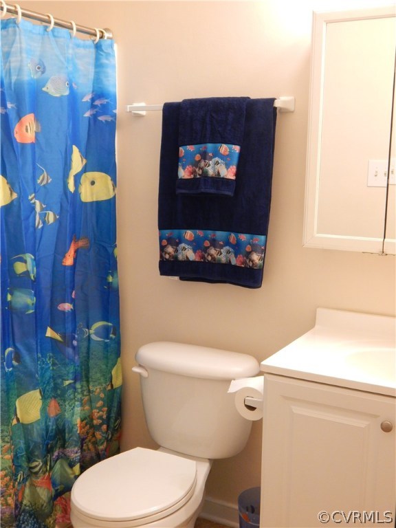 4813 Rollingway Road Chesterfield, VA 23832 - Photo 7 of 13 a white toilet sitting next to a bathroom sink