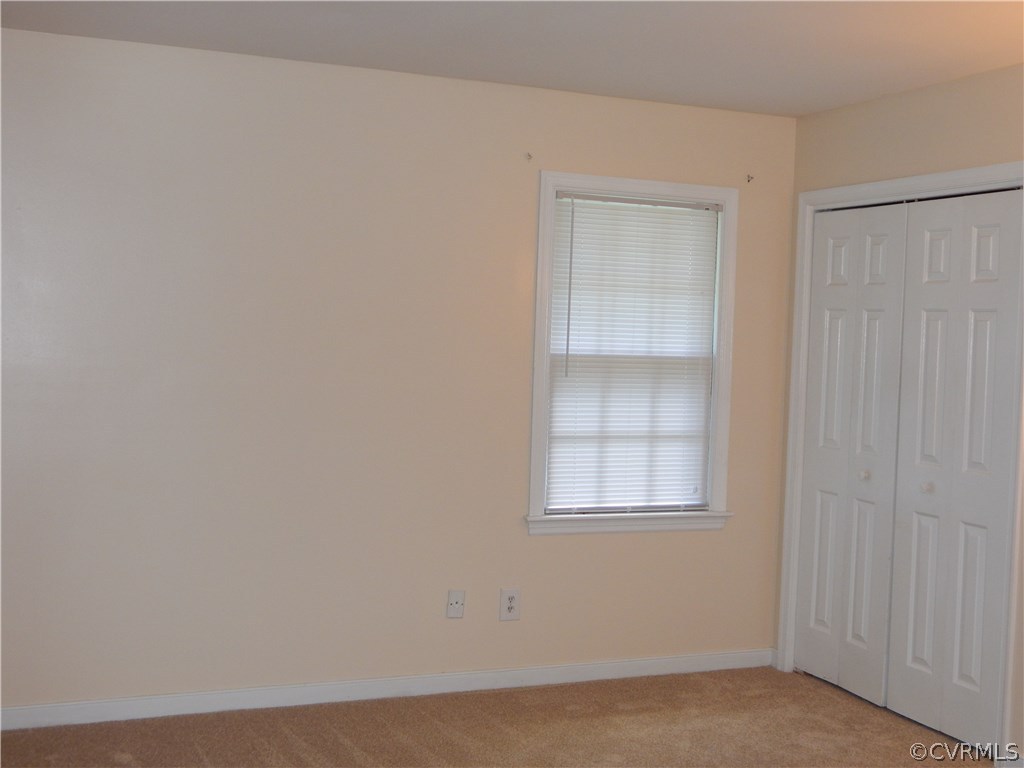4813 Rollingway Road Chesterfield, VA 23832 - Photo 8 of 13 an empty room with windows and cabinet