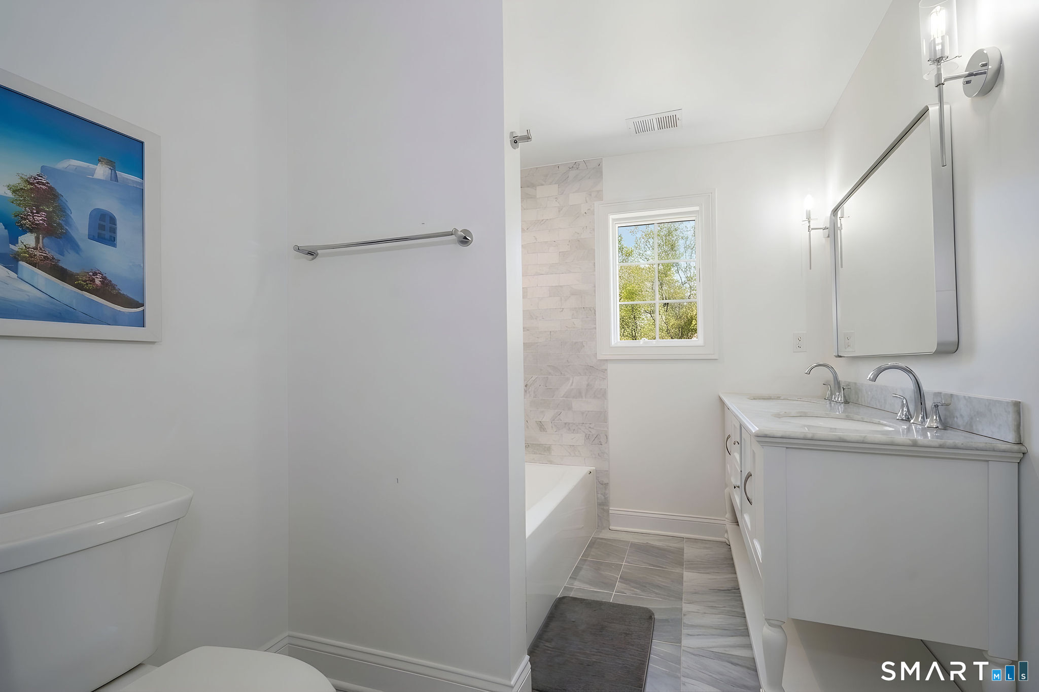 9 Sunset Ridge Drive Guilford, CT 06437 - Photo 26 of 40 a bathroom with a toilet sink and mirror