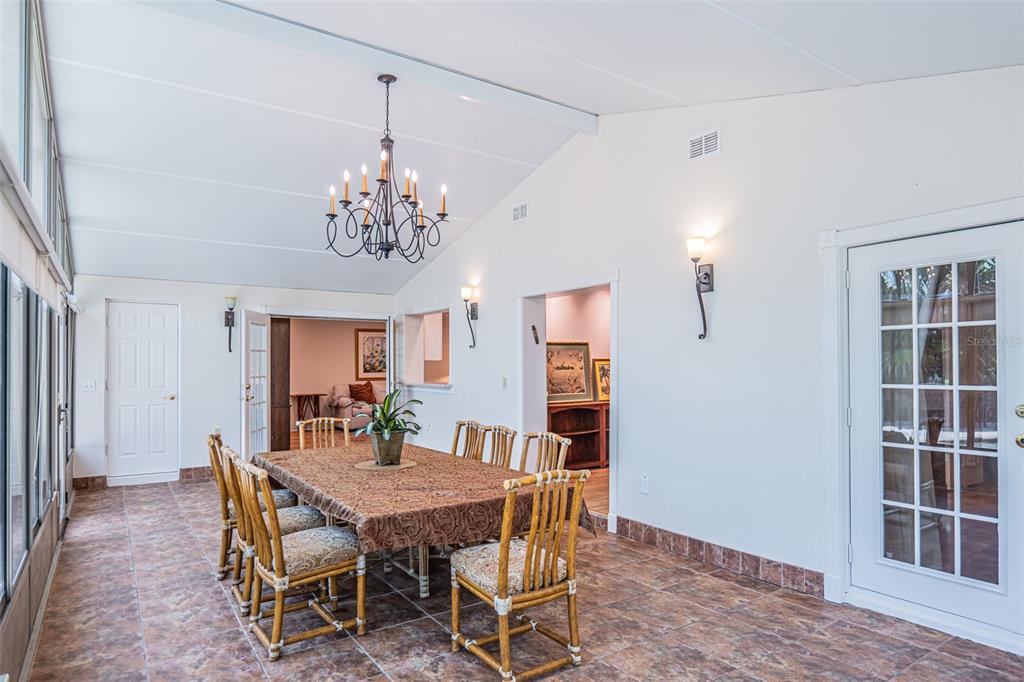 741 Brookside Road Maitland, FL 32751 - Photo 16 of 43 a view of a dining room with furniture and wooden floor