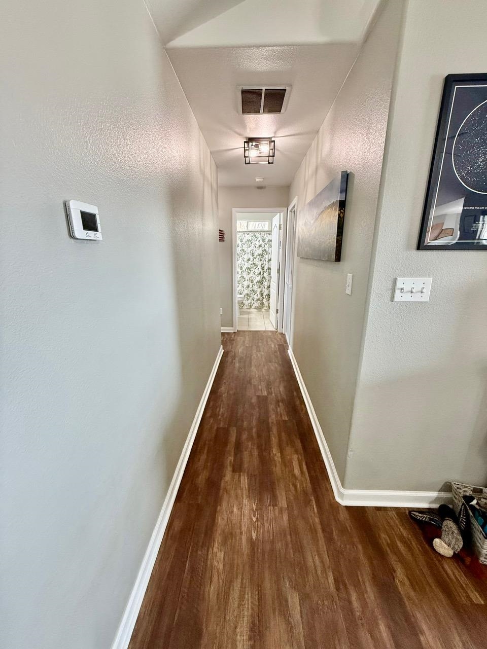 746 Granite Drive Fruita, CO 81521 - Photo 11 of 19 a view of a hallway with wooden floor