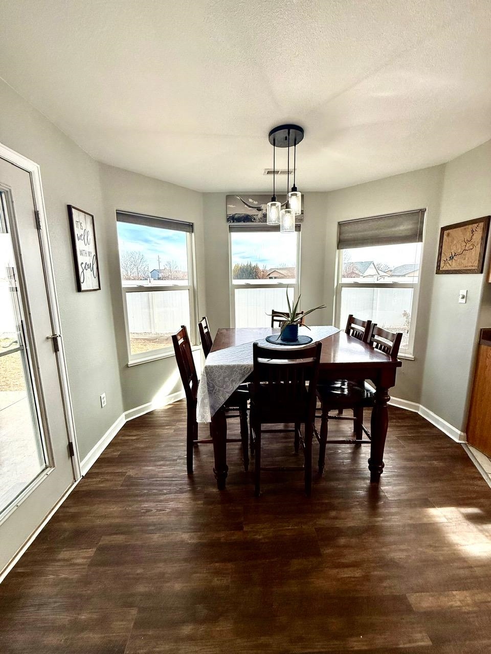 746 Granite Drive Fruita, CO 81521 - Photo 7 of 19 a view of a dining room with furniture window and wooden floor