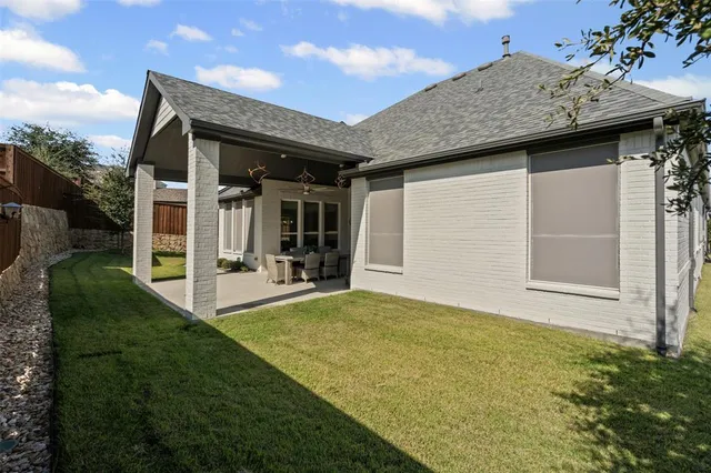 a view of an house with backyard porch and furniture