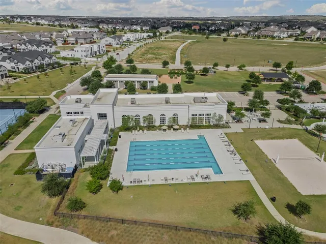 an aerial view of a house with a lake view