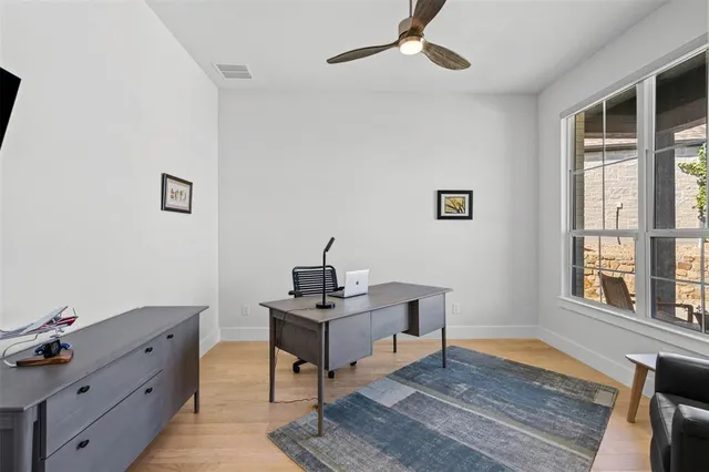 a workspace with furniture and window