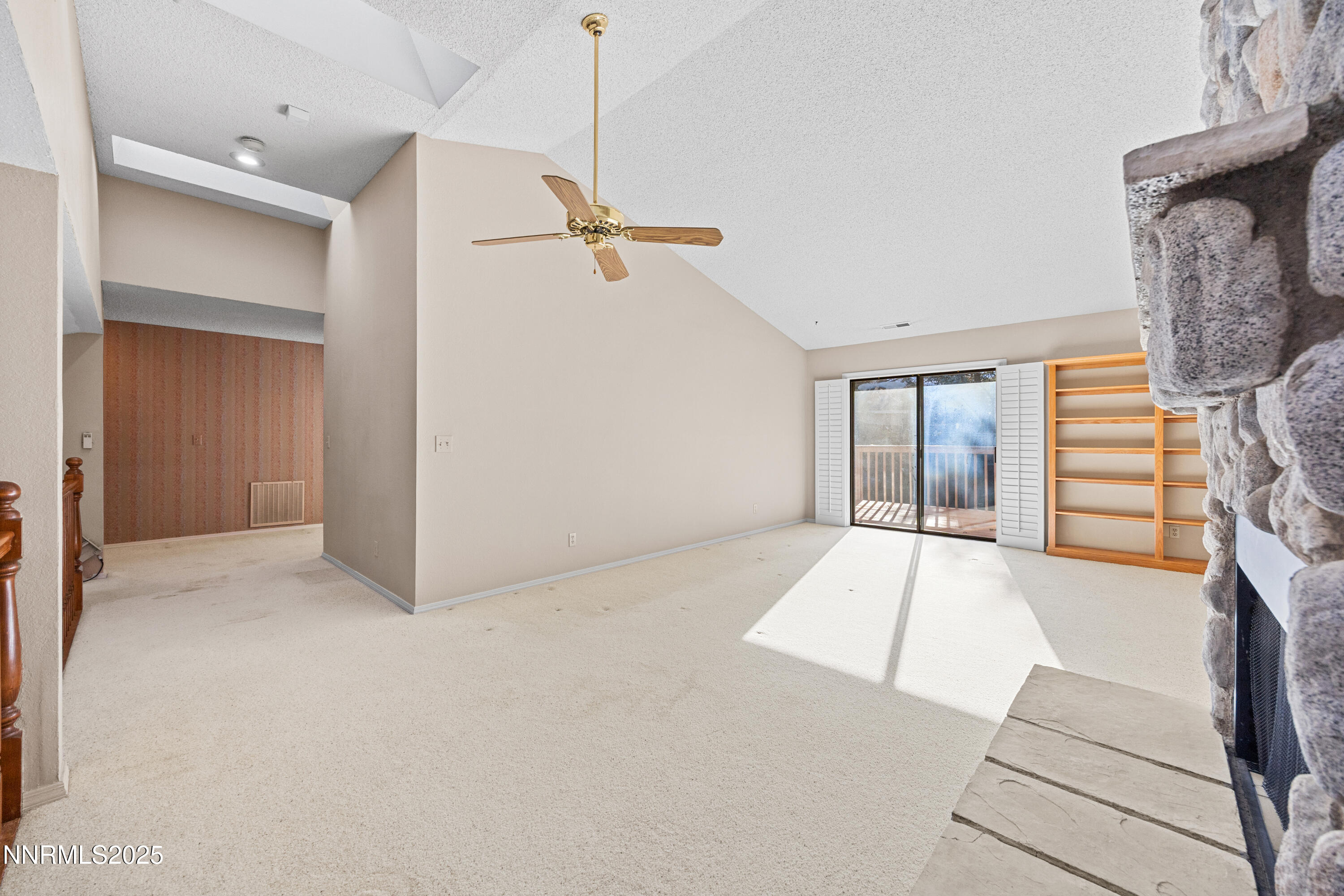 6299 Stone Valley Drive Reno, NV 89523 - Photo 20 of 70 a view of an empty room with a fireplace