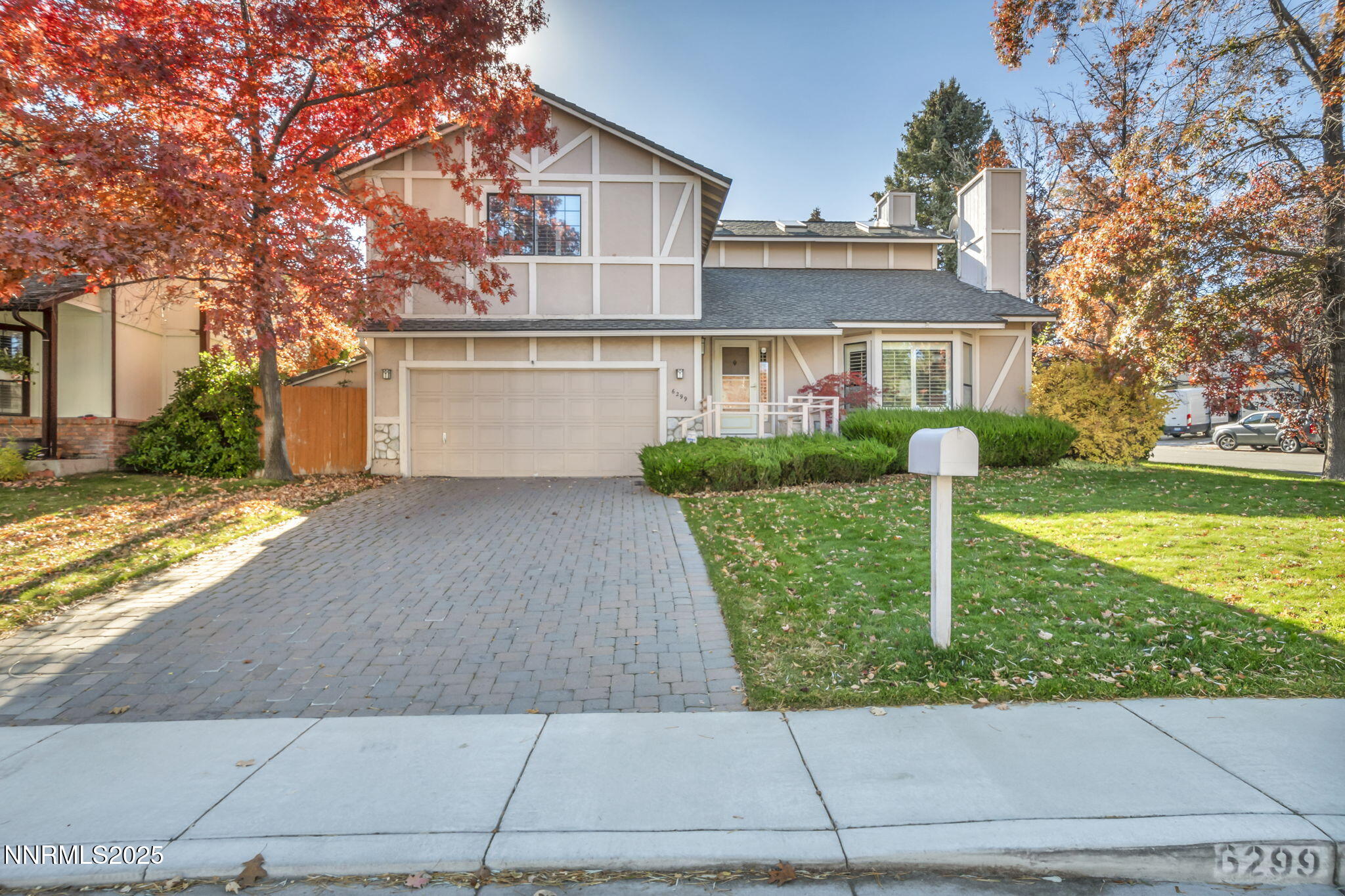6299 Stone Valley Drive Reno, NV 89523 - Photo 2 of 70 a front view of a house with a yard and garage