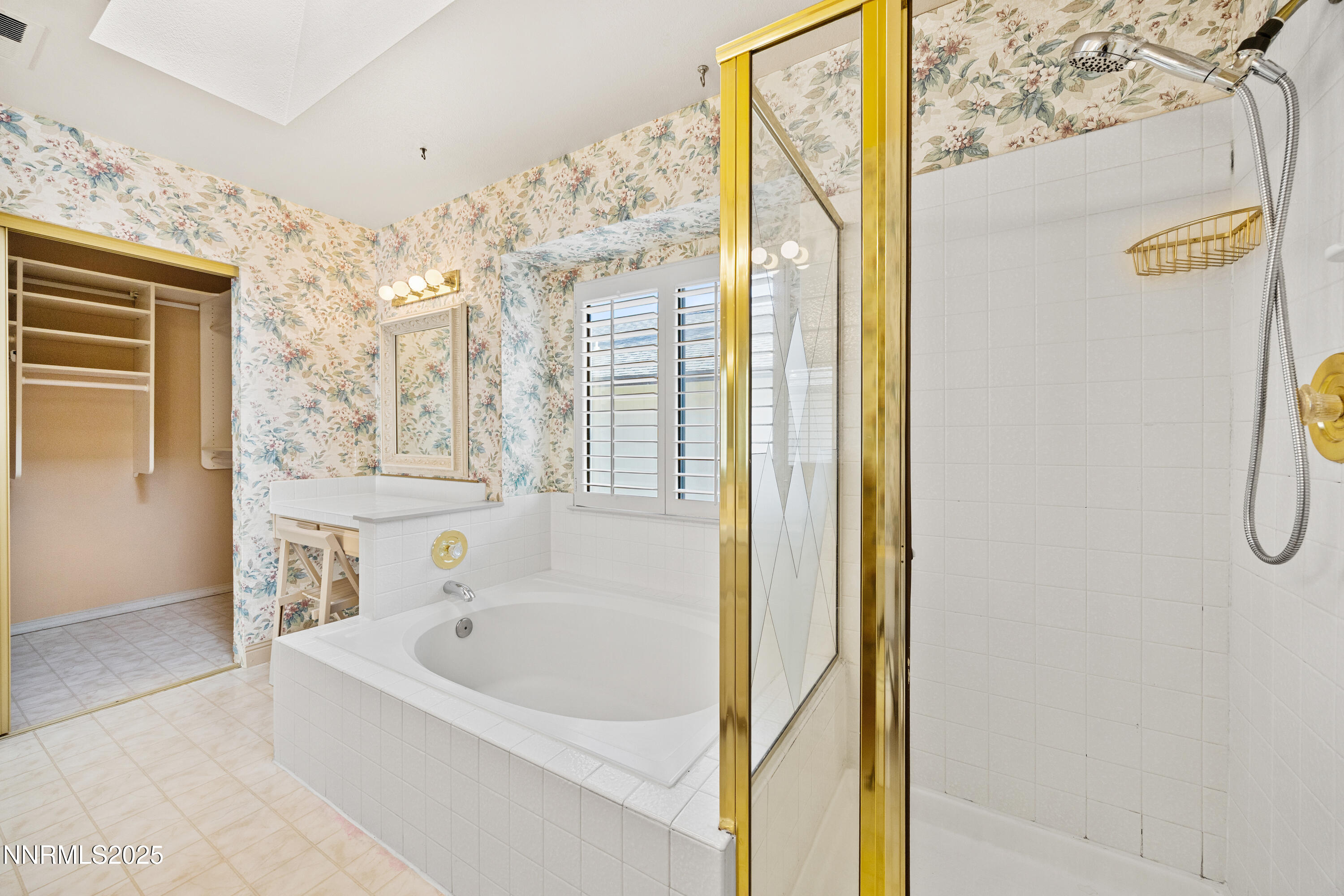 6299 Stone Valley Drive Reno, NV 89523 - Photo 27 of 70 a bathroom with a bathtub and a shower