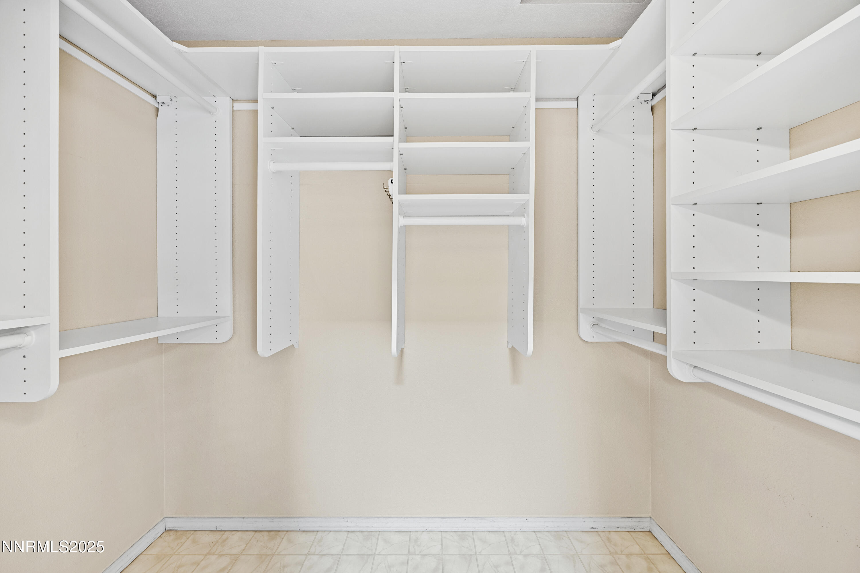 6299 Stone Valley Drive Reno, NV 89523 - Photo 28 of 70 a view of walk in closet with empty racks