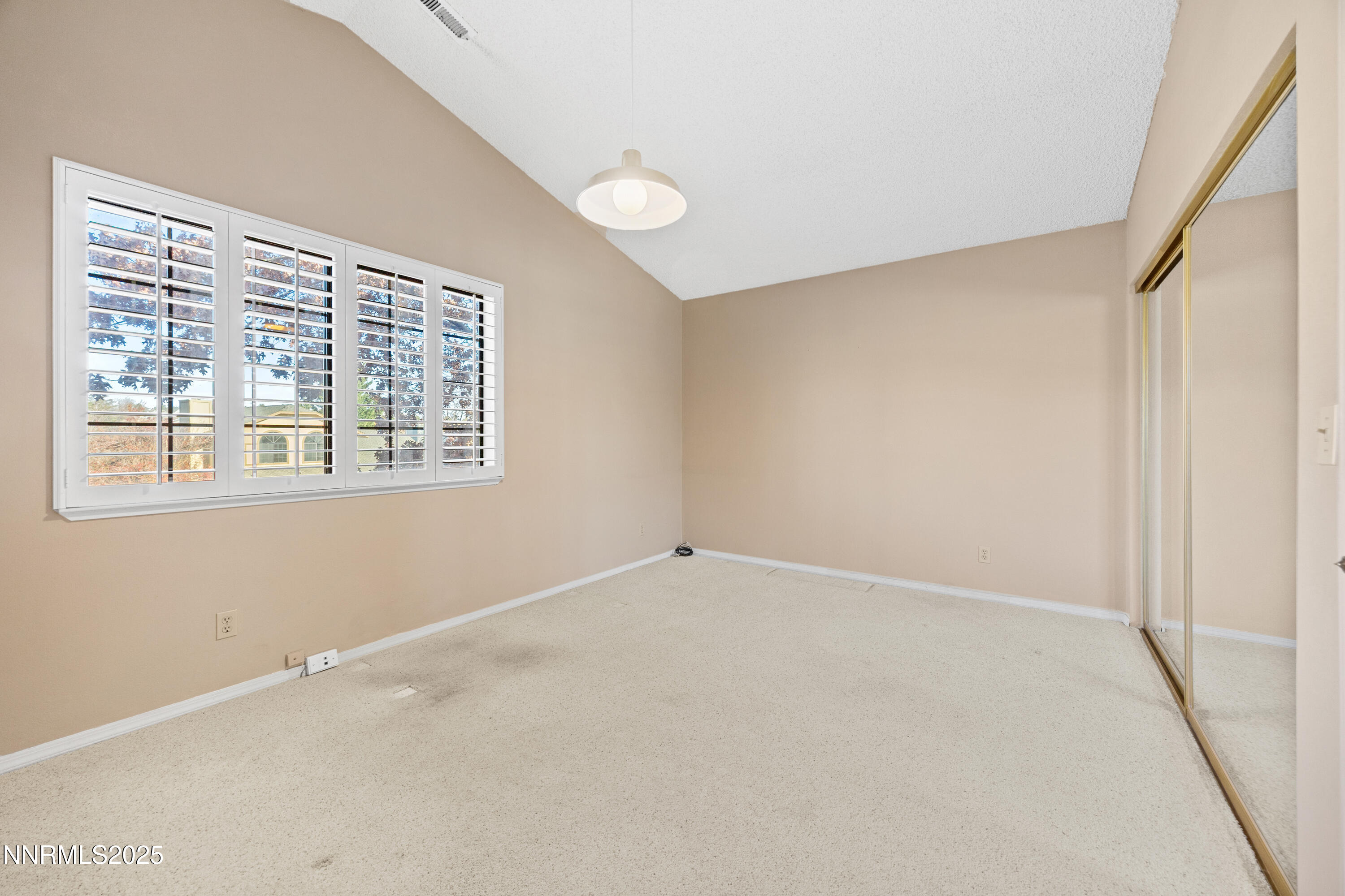 6299 Stone Valley Drive Reno, NV 89523 - Photo 29 of 70 an empty room with windows