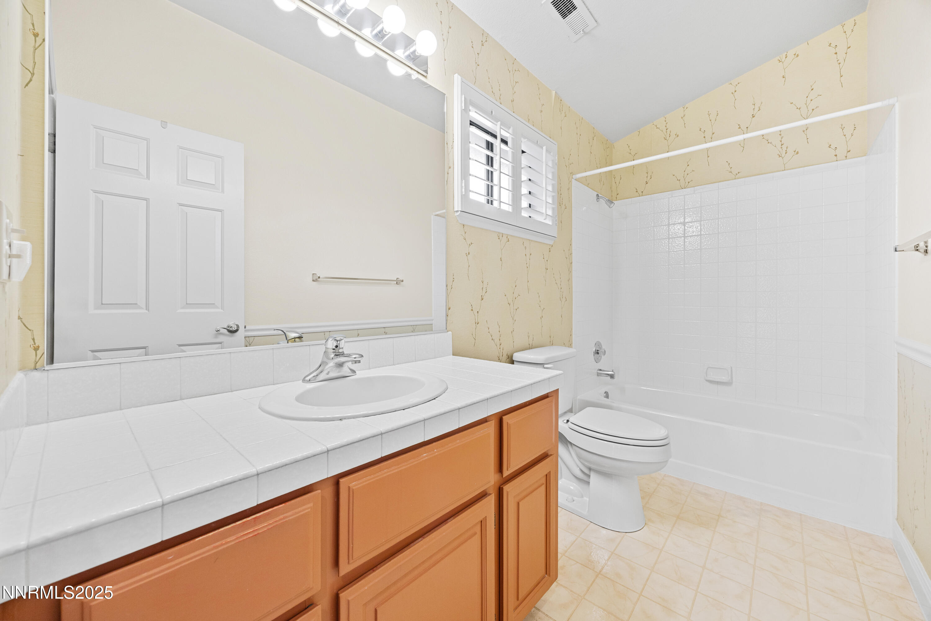 6299 Stone Valley Drive Reno, NV 89523 - Photo 35 of 70 a bathroom with a sink a toilet and shower