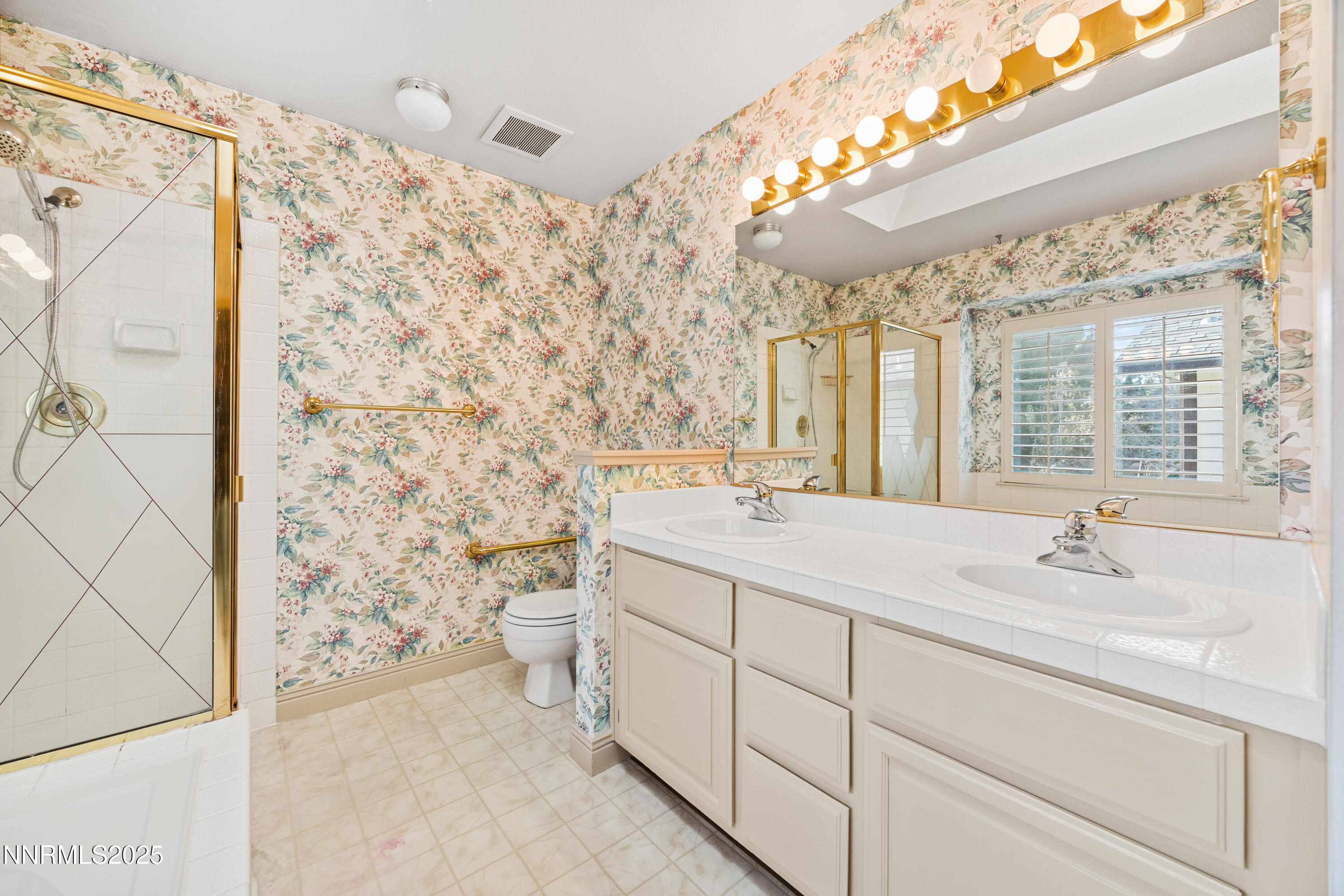 6299 Stone Valley Drive Reno, NV 89523 - Photo 39 of 70 a bathroom with a sink toilet and shower